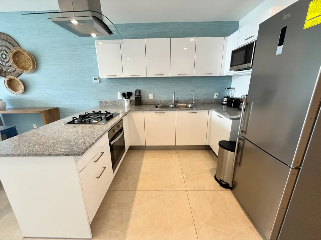 cocina con estufa departamento en venta camino al mar zona dorada